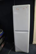 A TALL INDESIT FRIDGE FREEZER, height 188cm (PAT pass and working at 5 and -20 degrees) bottom