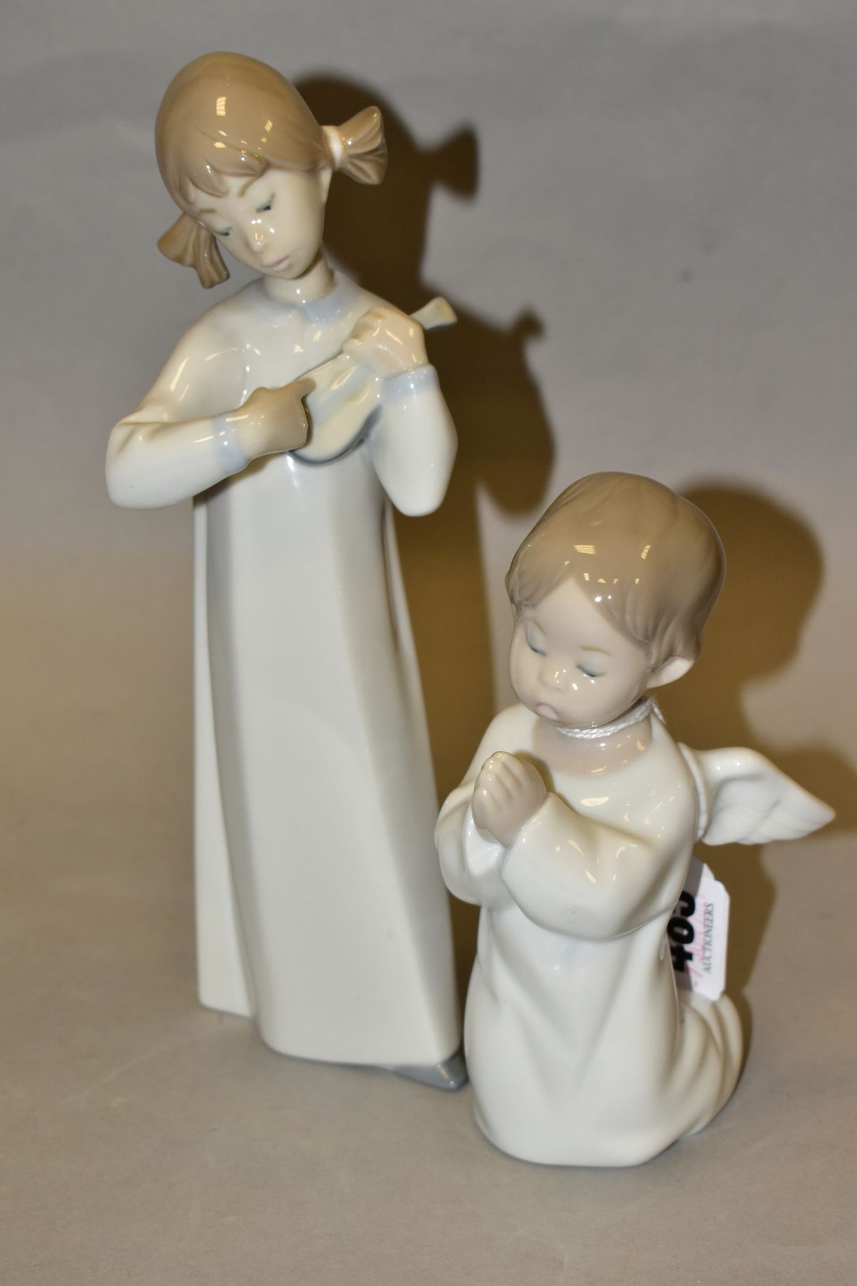 TWO LLADRO FIGURES, comprising Angel Praying No 4538, height 13.5cm and Girl with Guitar No 4871,