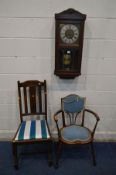 AN EARLY 20TH CENTURY OAK WALL CLOCK (winding key and pendulum), height 77cm together with an