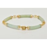 A 14CT GOLD JADE BRACELET, designed with five curved jade links, interspaced with openwork
