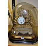 A MID VICTORIAN GILT METAL AND ALABASTER FIGURAL MANTEL CLOCK UNDER GLASS DOME, enamel dial with