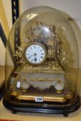 A MID VICTORIAN GILT METAL AND ALABASTER FIGURAL MANTEL CLOCK UNDER GLASS DOME, enamel dial with