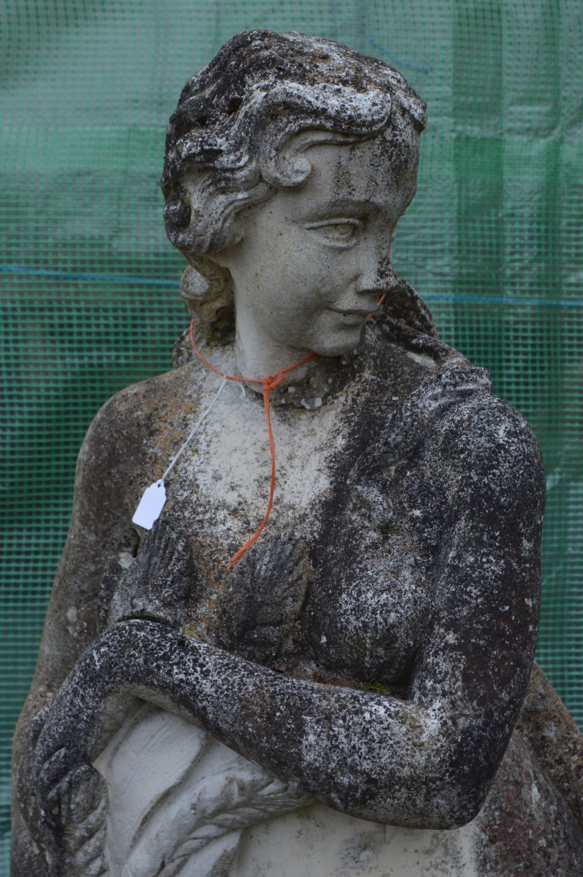 A LARGE WEATHERED COMPOSITE GARDEN STATUE of a semi clad lady in flowing robes, collecting the - Image 2 of 4