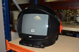 A PHILIPS DISCOVERER TV SHAPED AS SPACE HELMET, in red and black with sliding visor over the screen,