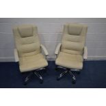 A PAIR OF CREAM FAUX LEATHER OFFICE SWIVEL CHAIRS on chrome frames