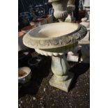 A COMPOSITE GARDEN CAMPANA URN, on a matched pillar support, diameter 65cm x height 86cm