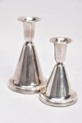 TWO NORWEGIAN SILVER DOMED CANDLESTICKS, each of a plain polished design, on round weighted bases,