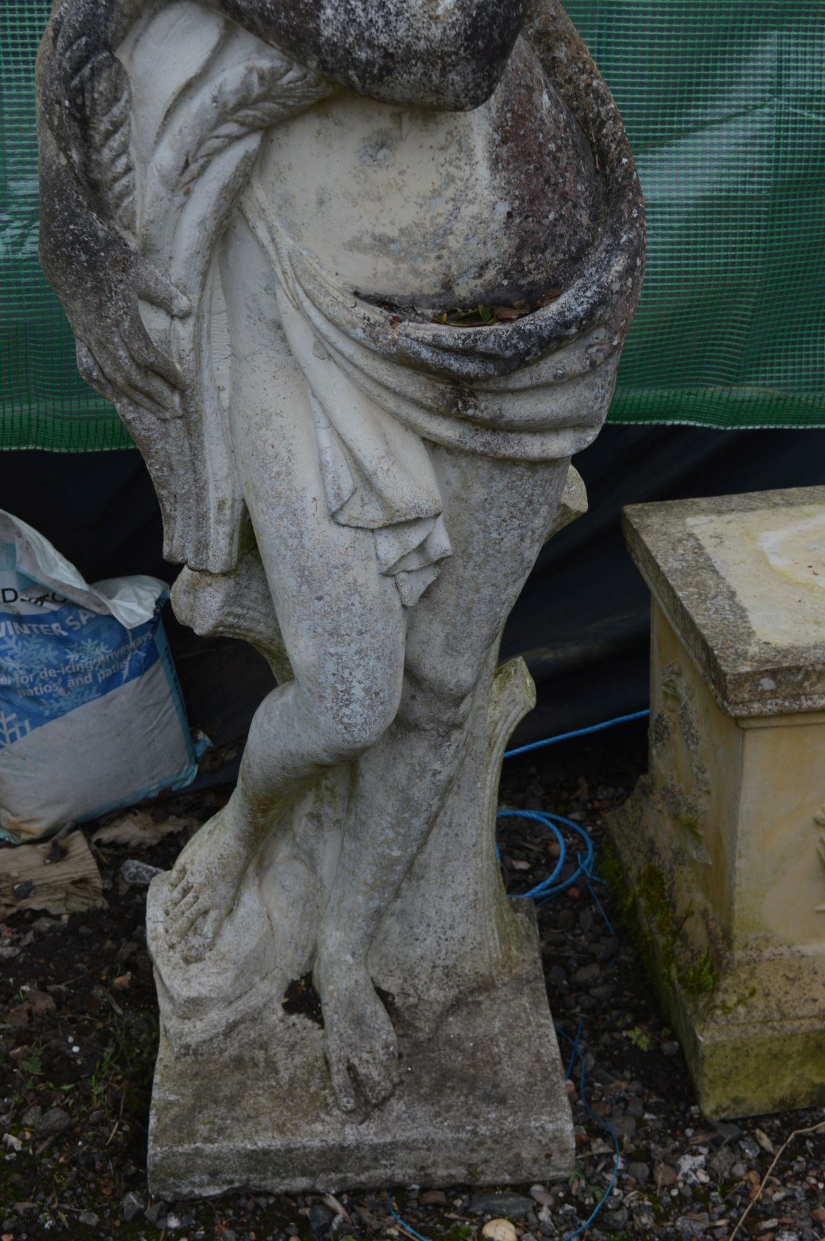 A LARGE WEATHERED COMPOSITE GARDEN STATUE of a semi clad lady in flowing robes, collecting the - Image 3 of 4