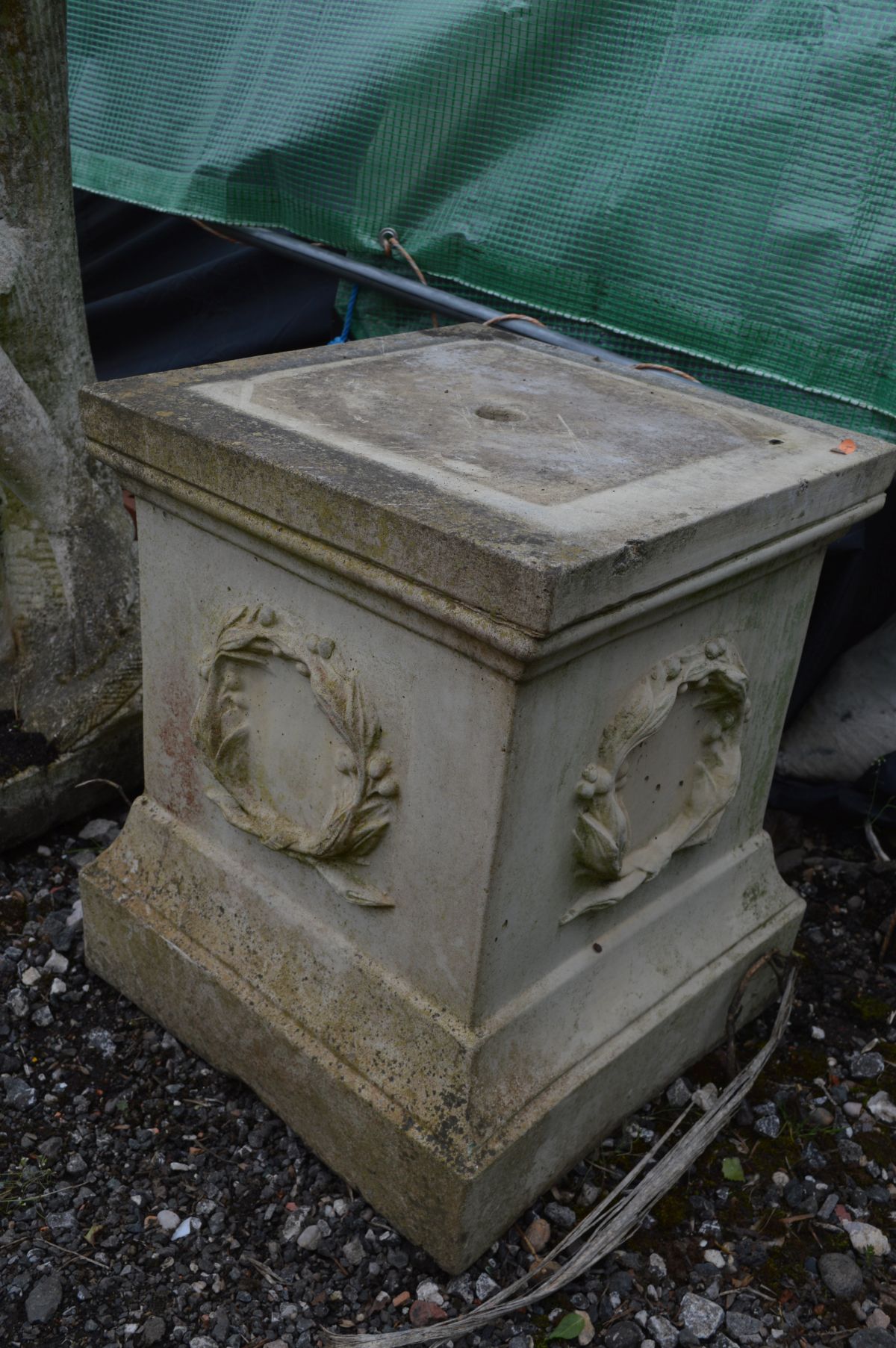 A LARGE WEATHERED COMPOSITE GARDEN STATUE of a semi clad lady in flowing robes, holding a bowl, on a - Image 4 of 4