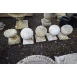 A SET OF FOUR COMPOSITE BALL FINIALS, another finial (5)