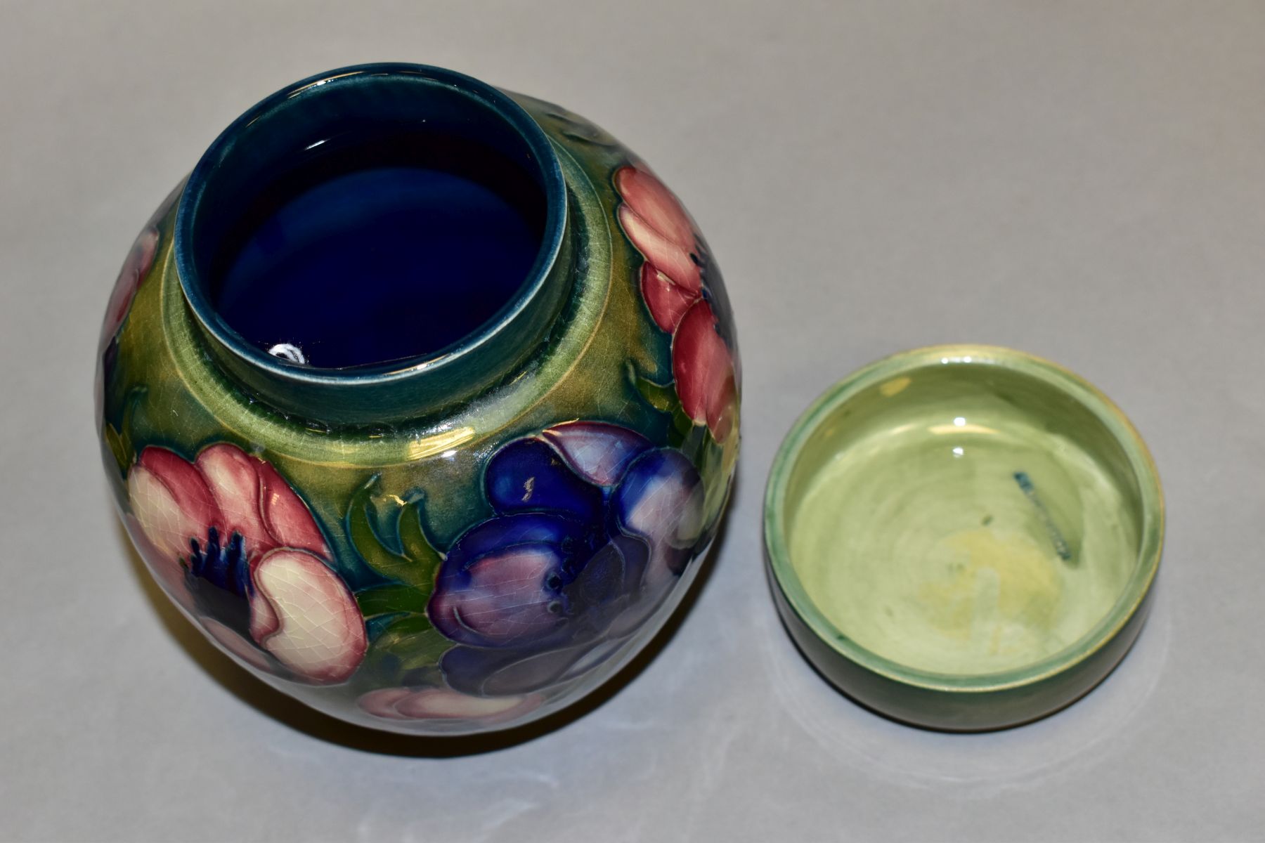 A MOORCROFT POTTERY GINGER JAR AND COVER, decorated in pink/blue anemone on a green ground, - Image 5 of 6