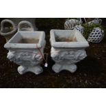 A PAIR OF SQUARE PLANTERS, with lions masks to each corner, later painted white, 35cm squared x