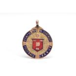 A 9CT GOLD ENAMELLED FOB PENDANT, of a circular form, blue and red enamel inscribed 'Stafford &