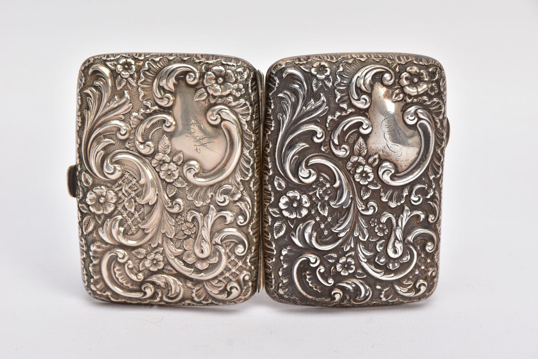 A LATE VICTORIAN, SILVER EMBOSSED CIGARETTE CASE, floral and foliate embossed design, engraved