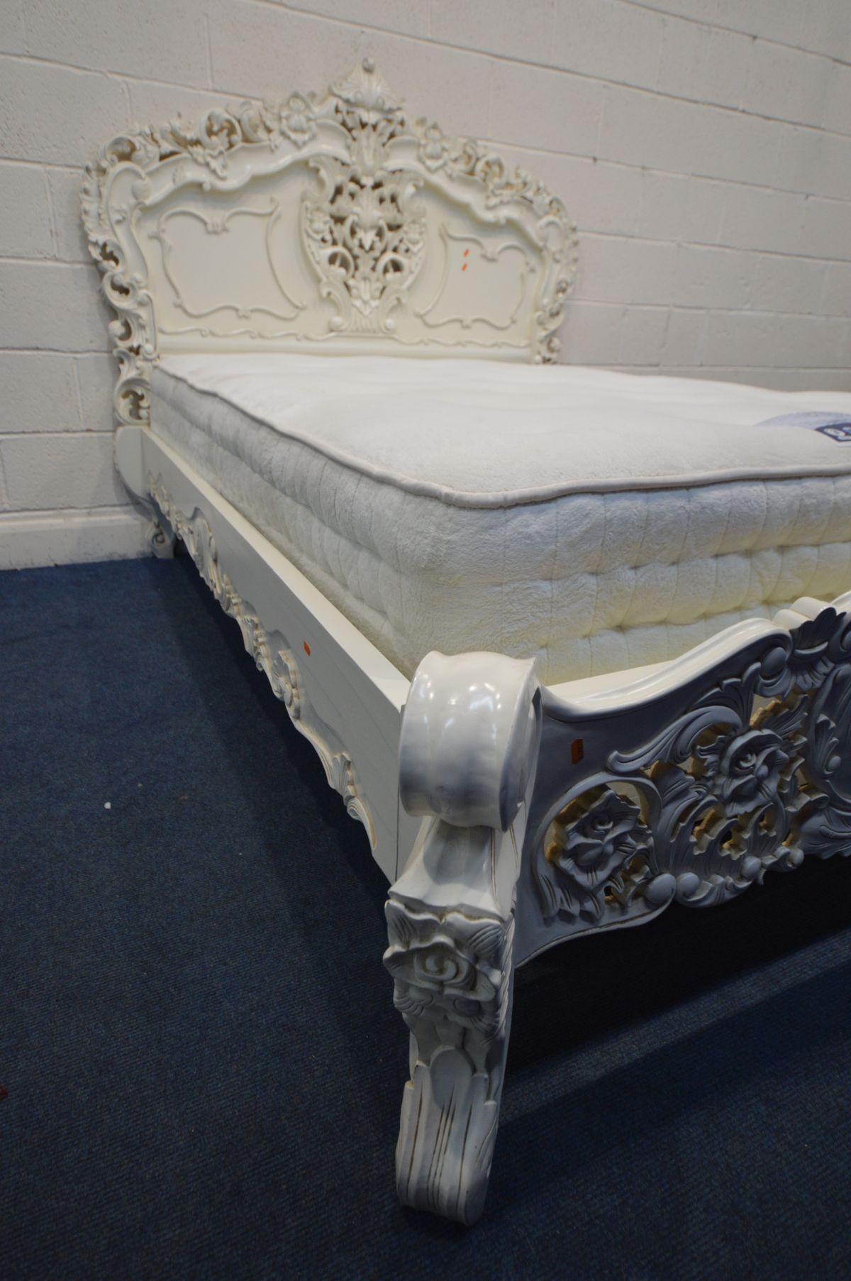 A LATE 20TH CENTURY CREAM PAINTED CONTINENTAL 4FT6 BEDSTEAD, with heavy ornate carved decoration, - Image 2 of 4