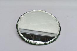 A 1920'S CIRCULAR MIRROR TABLE TOP STAND, with notched edge, with hanging hooks verso, diameter