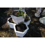 A SET OF FOUR COMPOSITE HEXAGONAL PLANTERS, later painted white, diameter 33cm x height 26cm