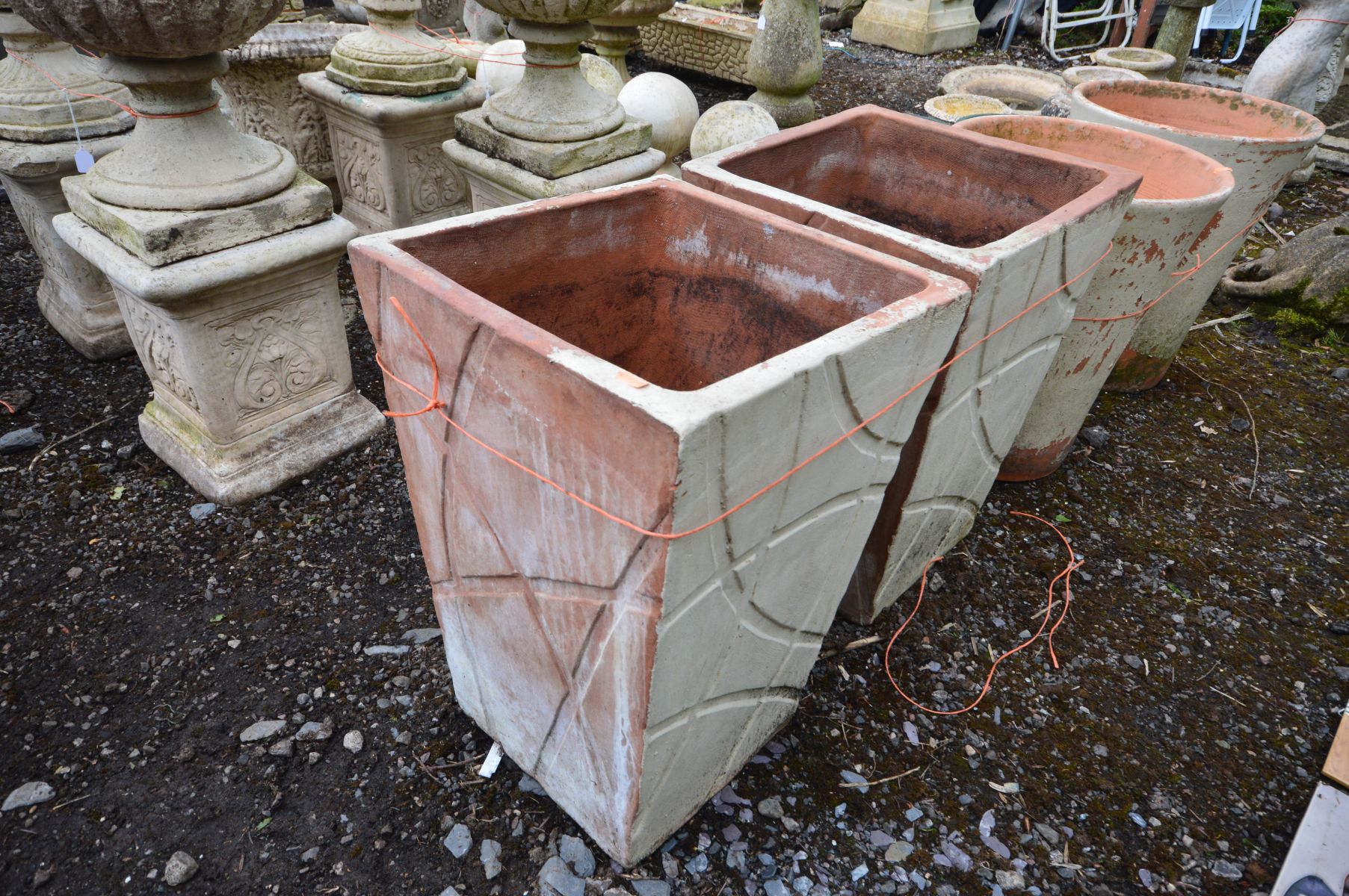 A PAIR OF TAPERED SQUARE TERRACOTTA PLANTERS with a modern carved decoration, outer side later - Image 2 of 2