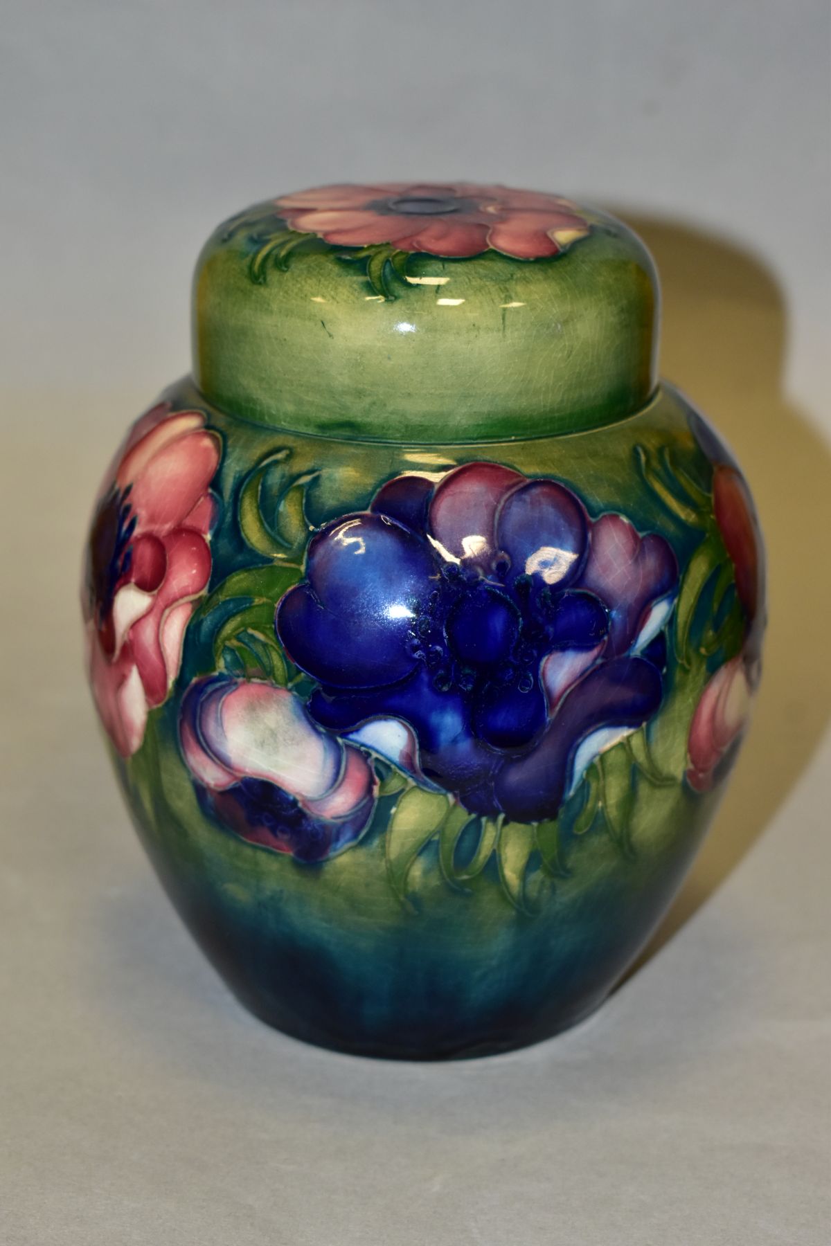 A MOORCROFT POTTERY GINGER JAR AND COVER, decorated in pink/blue anemone on a green ground, - Image 3 of 6