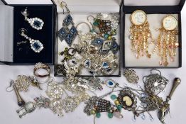 A BAG OF ASSORTED COSTUME JEWELLERY, to include various tangled white metal pendant necklaces,