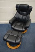 A BLACK FAUX LEATHER SWIVEL MASSAGING CHAIR on a beech circular base (PAT pass and working)