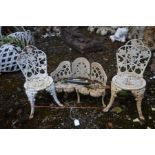 A MINIATURE CAST IRON CURVED GARDEN BENCH, and two chairs (3)