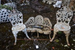 A MINIATURE CAST IRON CURVED GARDEN BENCH, and two chairs (3)