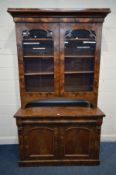 A VICRTORIAN FLAME MAHOGANY BOOKCASE, the marriage top with a fixed cornice above double glazed