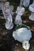 A COMPOSTE URN STYLE WALL PLANTER, along with a figure of a fairy holding a flower and putto bird