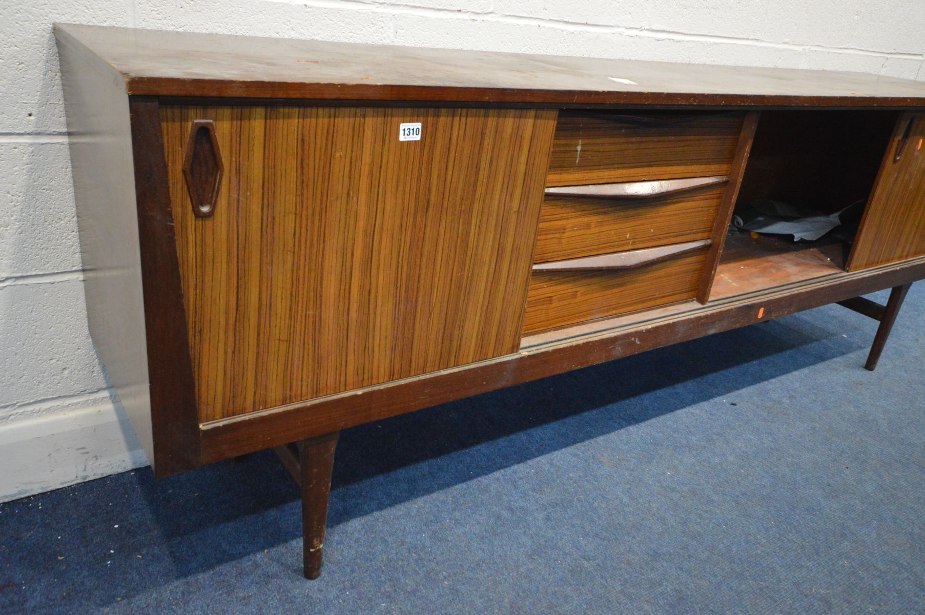 AN AFROMOSIA SIDEBOARD with zebrawood sliding doors and three drawers, on tapering legs, width 221cm - Image 2 of 5