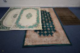 A LARGE GREEN CHINESE WOOLEN RUG, 240cm x 150cm, two similar cream and green ground rugs, both 180cm