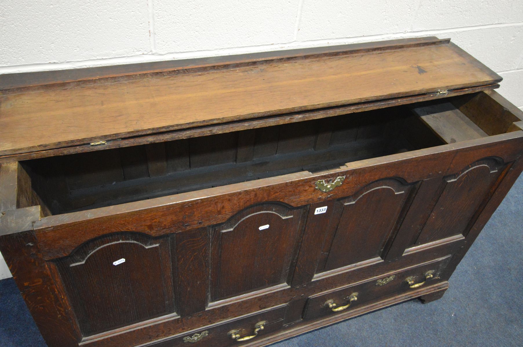 A GEORGIAN OAK MULE CHEST, four fielded panels above two drawers with brass escutcheons and drop - Image 4 of 4