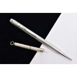 A SILVER PROPELLING PENCIL AND A SILVER CIGAR PIERCER, the propelling pencil with an engine turn