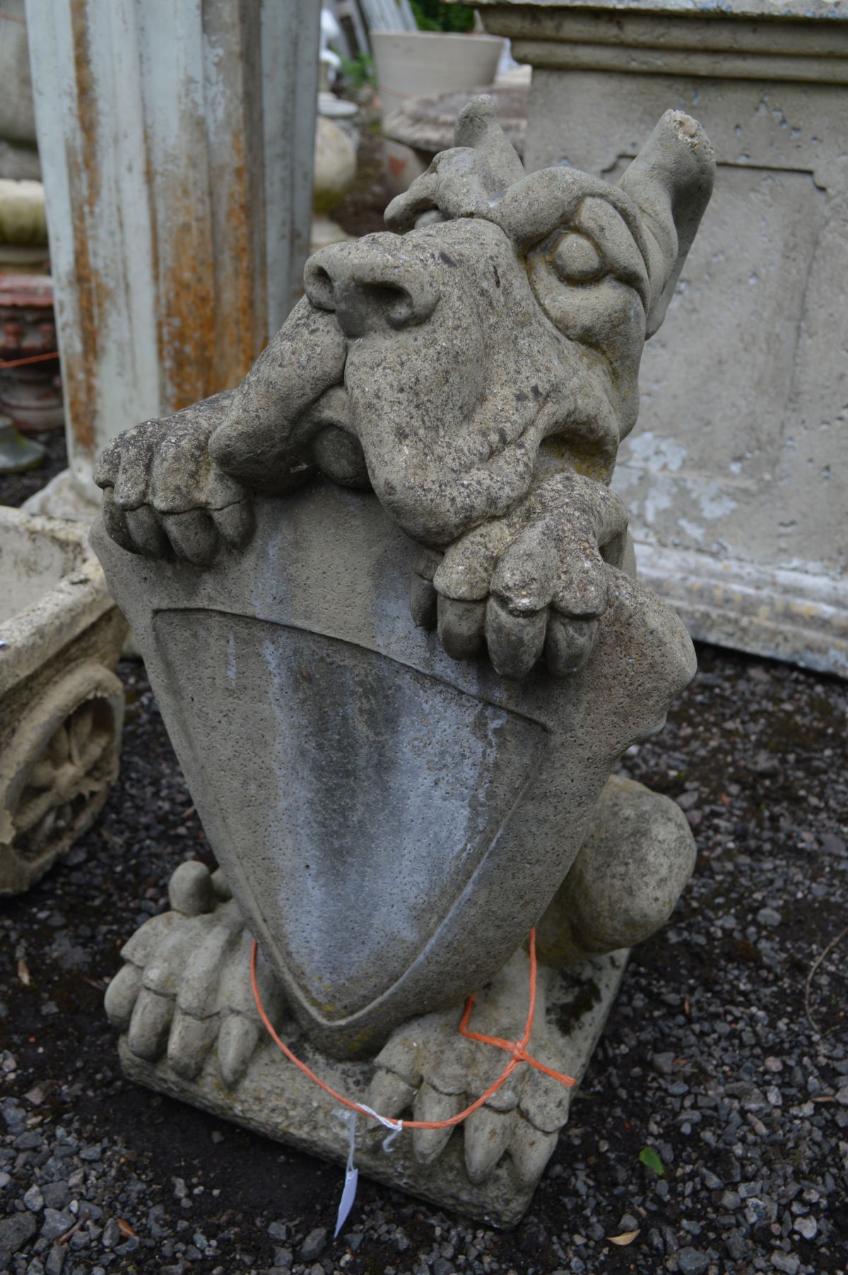 A COMPOSITE GARDEN FIGURE of a hound holding a shield, along with a composite planter of a donkey - Image 2 of 3