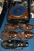 A COLUMBIA PORTABLE GRAMOPHONE, NO.202, together with a pair of carved wooden wall/face plaques,