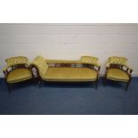 AN EDWARDIAN WALNUT PARLOUR SUITE with mustard button back upholstery and foliate fretwork