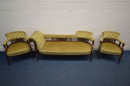 AN EDWARDIAN WALNUT PARLOUR SUITE with mustard button back upholstery and foliate fretwork