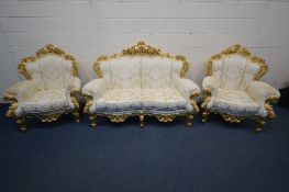 A FRENCH GILTWOOD FRAMED THREE PIECE SUITE, in the rococo style, floral gold upholstery,