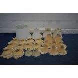 A COLLECTION OF YELLOW AND CREAM LAMP SHADES, to include table lamp and branch lamp shades (24)