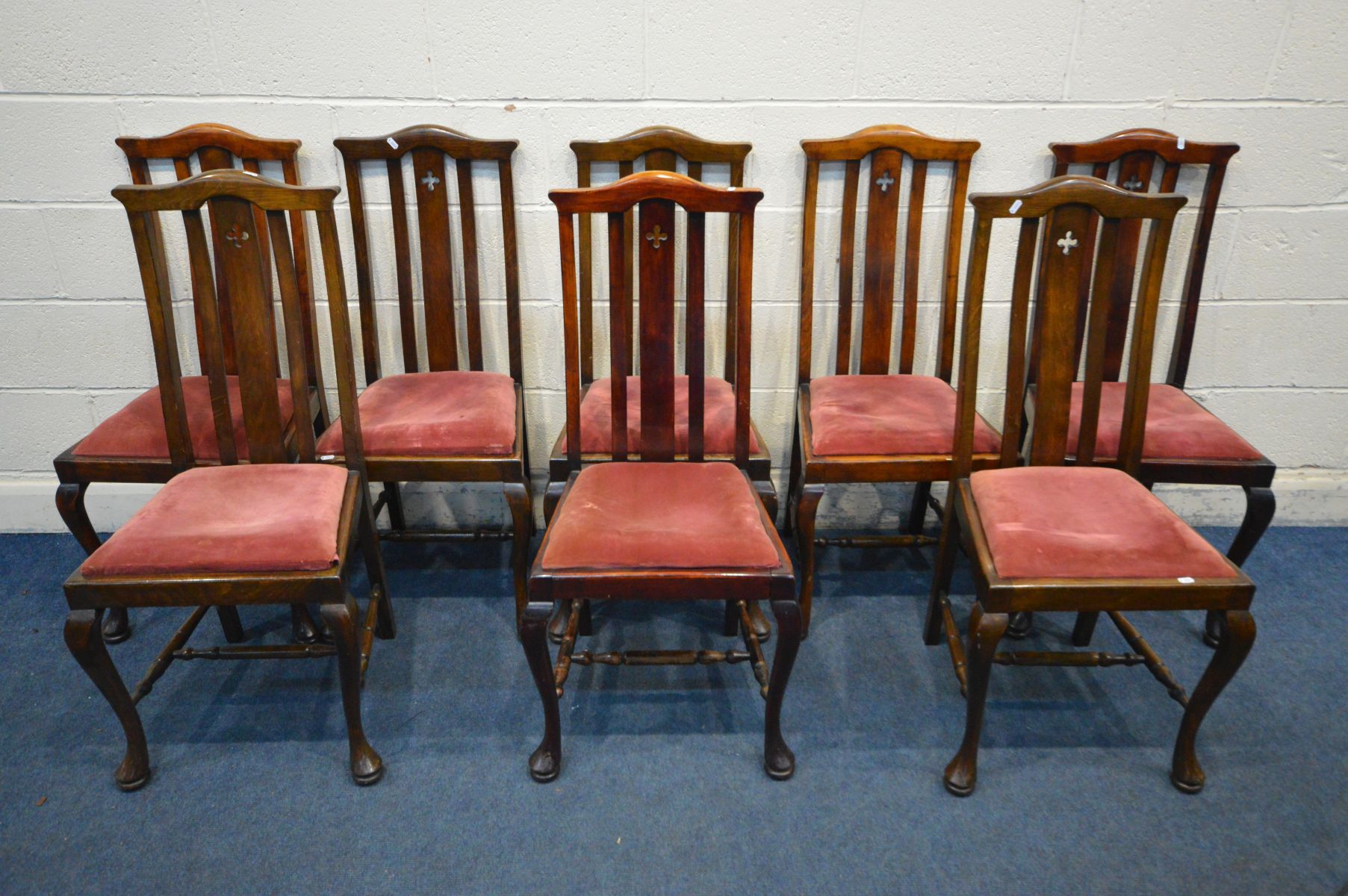 A SET OF EIGHT EARLY 20TH CENTURY STAINED BEECH DINING CHAIRS, with pierced quatrefoil to central