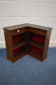 A SMALL EARLY 20TH CENTURY MAHOGANY CORNER OPEN BOOKCASE, with later added red fabric to