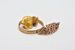 A YELLOW METAL RING, ROSE GOLD HEAD OF A RING AND A GOLD TONE TOOTH CAP, the plain polished
