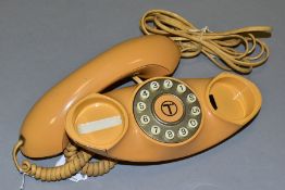 A B.T. GENIE PUSH BUTTON TELEPHONE, in caramel plastic, some signs of use and wear, wired for modern