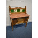 AN EDWARDIAN MARBLE TOP WASHSTAND, with a tiled back, width 91cm x depth 46cm x height 111cm