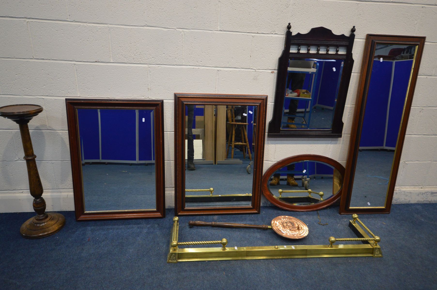 AN EXTENDING BRASS FENDER, a copper warming pan, beech torchere stand and five various mirrors,