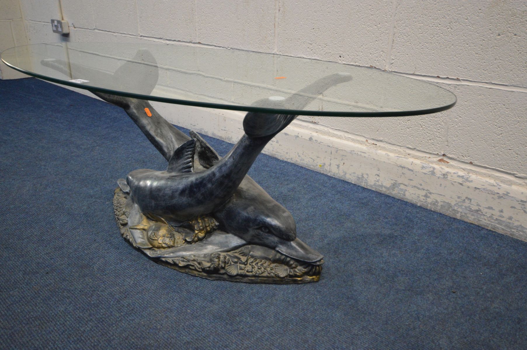 AN OVAL GLASS TOP COFFEE TABLE SUPPORTED ON TWO RESIN DOLPHINS lying on a sea bed, width 120cm x - Image 3 of 3