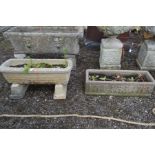 A COMPOSITE RECTANGULAR PLANTER, on twin separate bases, length 70cm x height 32cm along with