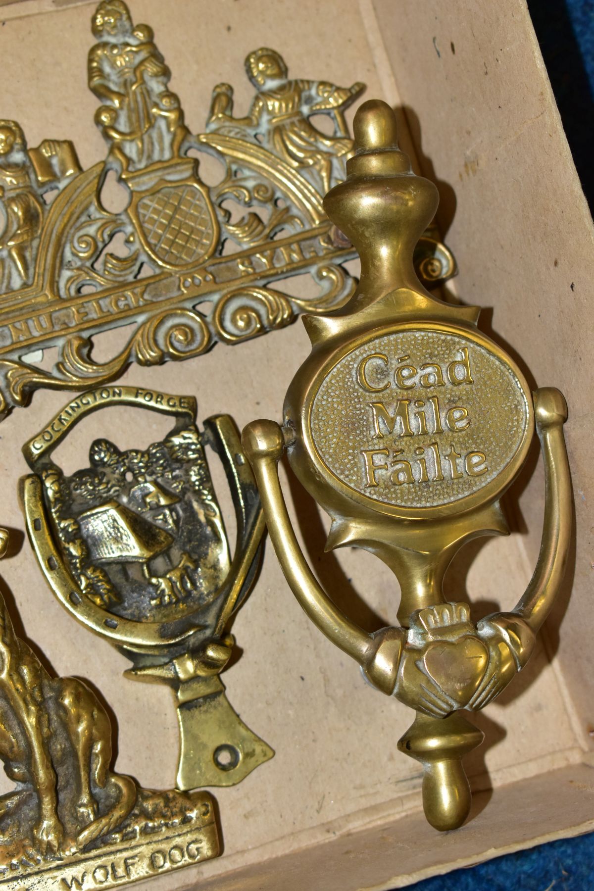 A SMALL BOX OF VARIOUS BRASS DOOR KNOCKERS, to include 'Cead Mile Failte', height 20cm, 'mayflower', - Image 2 of 3