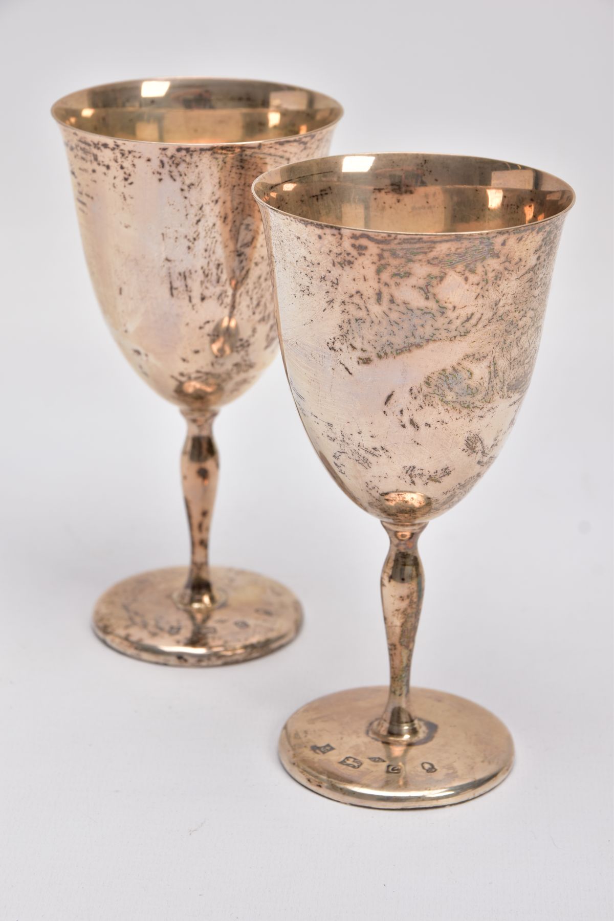 TWO LATE 20TH CENTURY SILVER GOBLETS, each of a plain polished design gilt interior, tapered stem,