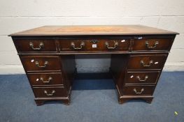 AN EARLY 20TH CENTURY MAHOGANY PEDESTAL DESK, with a triple leather tooled top with nine assorted